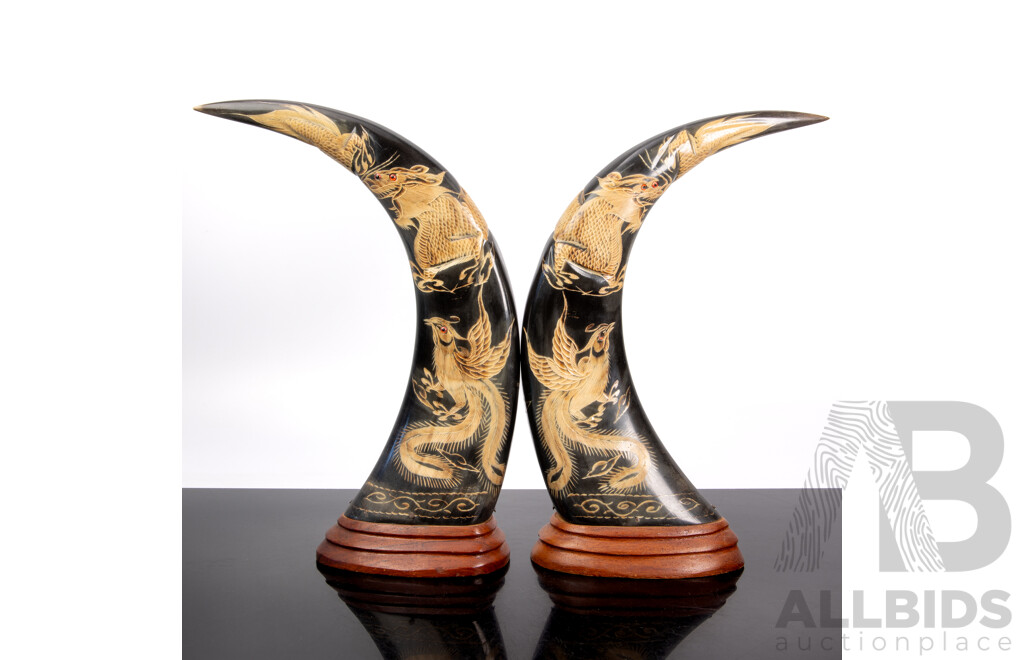 Pair Carved Asian Buffalo Horns Mounted on Wooden Pedestal Bases with Phoenix & Dragon Theme