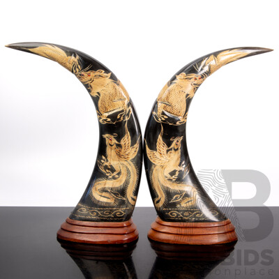 Pair Carved Asian Buffalo Horns Mounted on Wooden Pedestal Bases with Phoenix & Dragon Theme