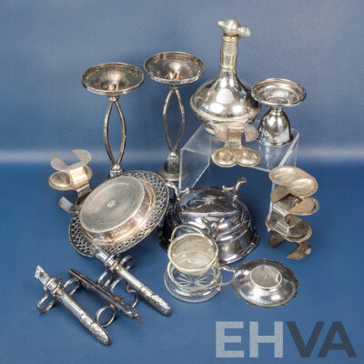 Collection of Vintage Silver Plate Table Pieces Including Egg Holders, Candlestick Pair, Unique Asparagus Tongs, Tea Strainer, Trinket Bowls