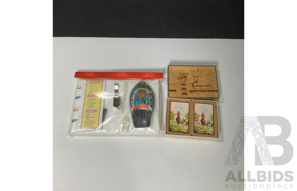 Vintage Tin Toy Clickers Including Two West German Examples, Marmite, Hutton's Pineapple Brand, Hudson Industries Canasta Playing Cards, Putt Putt Boat in Sealed Pack, Bradman Playing Cards, Wildflowers of Australia Cards