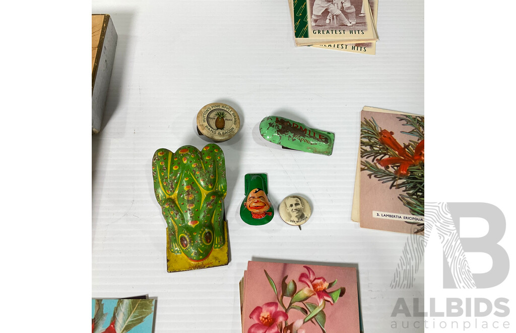 Vintage Tin Toy Clickers Including Two West German Examples, Marmite, Hutton's Pineapple Brand, Hudson Industries Canasta Playing Cards, Putt Putt Boat in Sealed Pack, Bradman Playing Cards, Wildflowers of Australia Cards
