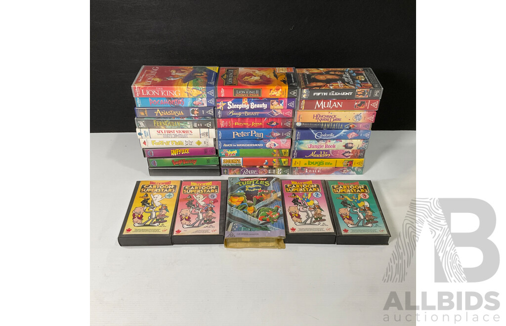 Box of Vintage VHS Cassette Tapes Including Looney Tunes, Disney, Smurfs, Ninja Turtles and More