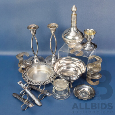 Collection of Vintage Silver Plate Table Pieces Including Egg Holders, Candlestick Pair, Unique Asparagus Tongs, Tea Strainer, Trinket Bowls
