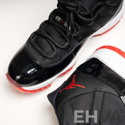 Pair of Nike Air Jordan 11 Retro Bred, 2012