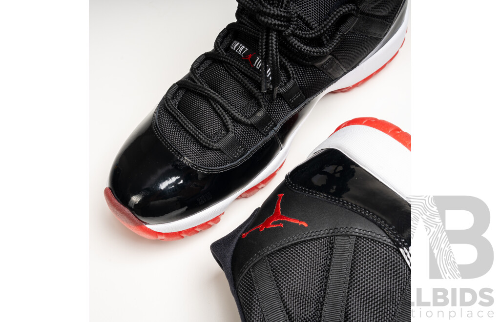 Pair of Nike Air Jordan 11 Retro Bred, 2012