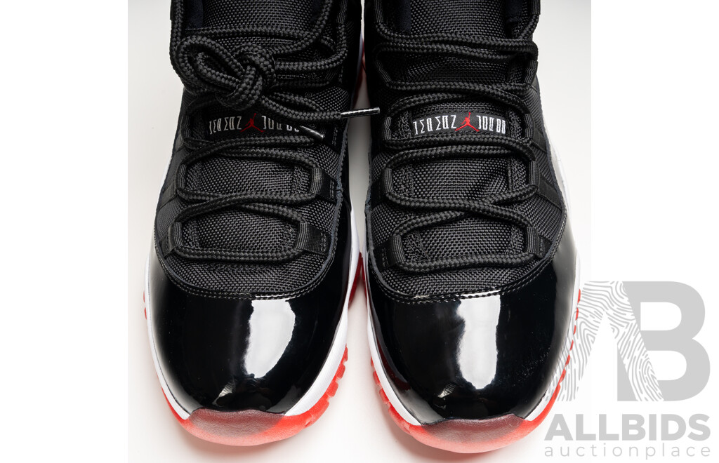 Pair of Nike Air Jordan 11 Retro Bred, 2012