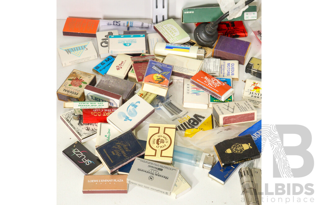 Vintage Cigarette Lighters Including Ronson Battery Powered, Imco Triplex Kerosene, Zippo Scrimshaw, DKNY Women's Watch with Box, Vintage Matchbox Collection Including Qantas and Life Be in It, Rollei Projector