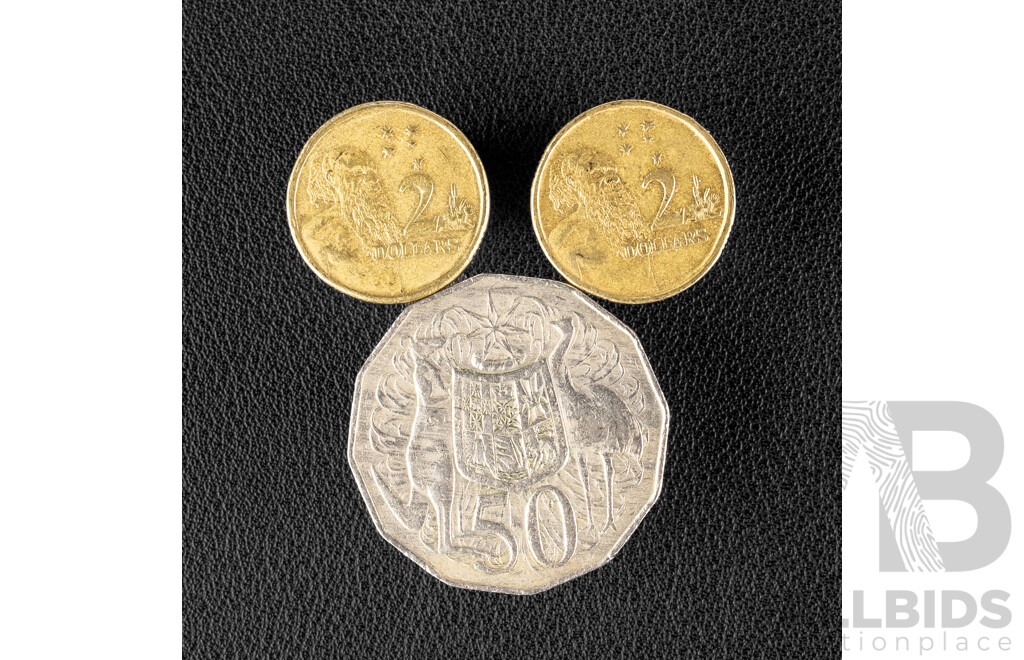 Two Australian 1999 Two Dollar Coins with Rim Errors and 1981 Fifty Cent Coin with Lamination Peel