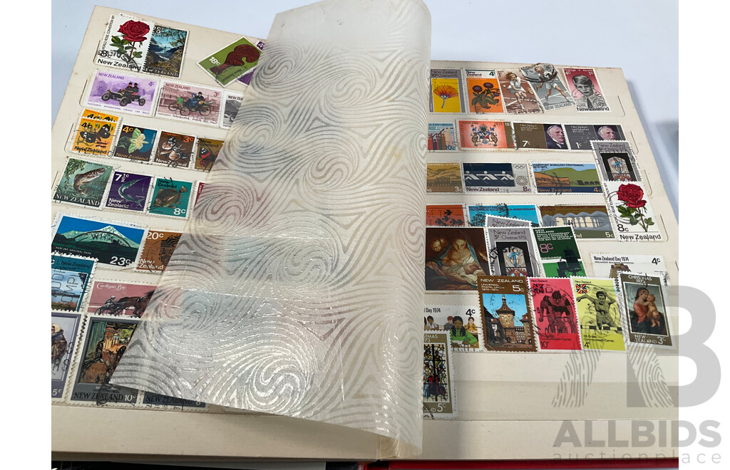 Two Albums of Vintage International Stamps Including Australian Predecimal, Canada, Great Britain, Philippines, Fiji, USA, Poland, Germany, New Zealand, Papua New Guinea and More
