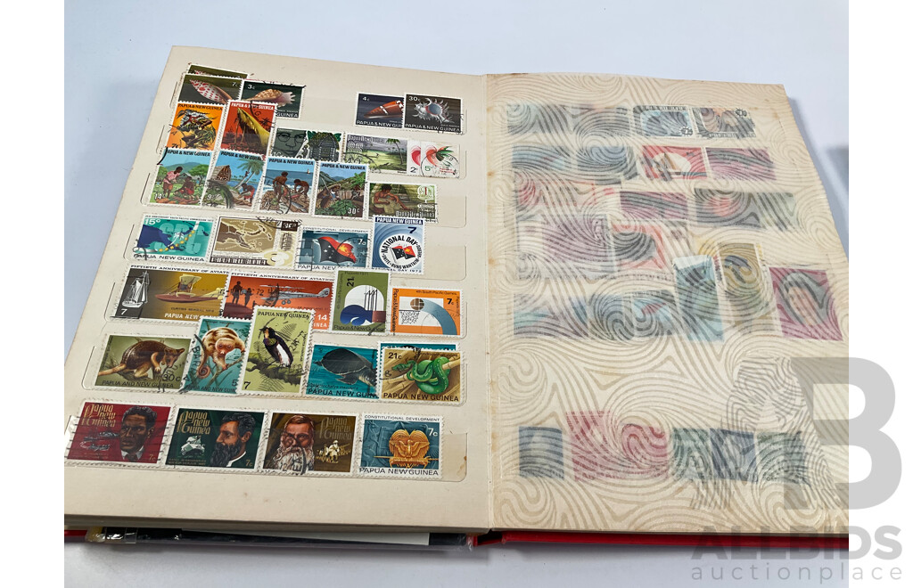 Two Albums of Vintage International Stamps Including Australian Predecimal, Canada, Great Britain, Philippines, Fiji, USA, Poland, Germany, New Zealand, Papua New Guinea and More