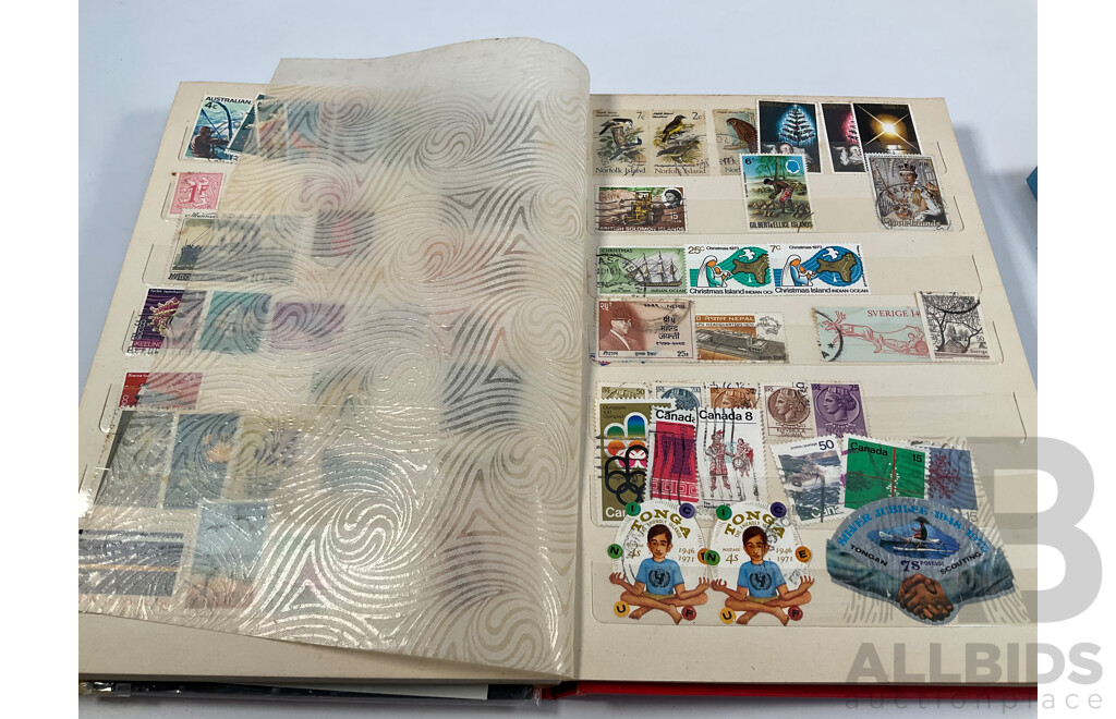 Two Albums of Vintage International Stamps Including Australian Predecimal, Canada, Great Britain, Philippines, Fiji, USA, Poland, Germany, New Zealand, Papua New Guinea and More