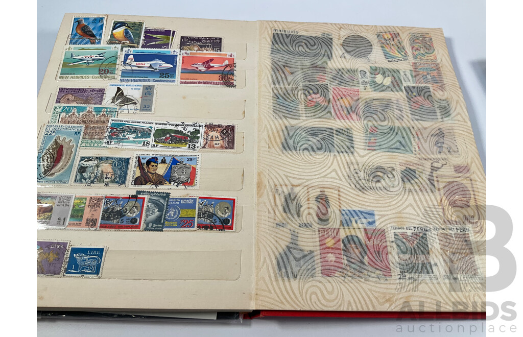 Two Albums of Vintage International Stamps Including Australian Predecimal, Canada, Great Britain, Philippines, Fiji, USA, Poland, Germany, New Zealand, Papua New Guinea and More