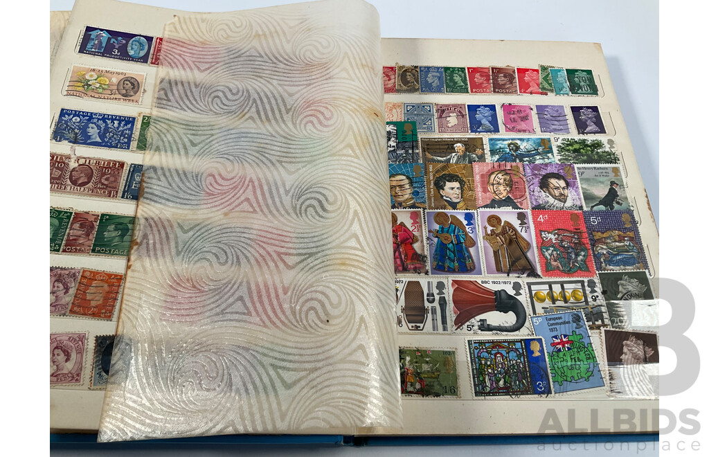 Two Albums of Vintage International Stamps Including Australian Predecimal, Canada, Great Britain, Philippines, Fiji, USA, Poland, Germany, New Zealand, Papua New Guinea and More
