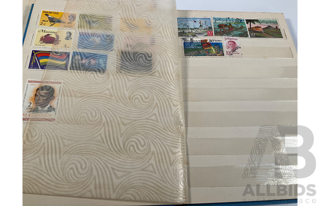 Two Albums of Vintage International Stamps Including Australian Predecimal, Canada, Great Britain, Philippines, Fiji, USA, Poland, Germany, New Zealand, Papua New Guinea and More