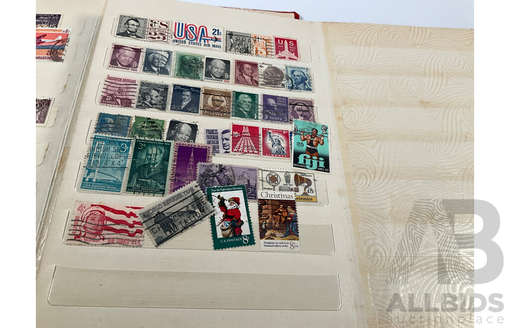 Two Albums of Vintage International Stamps Including Australian Predecimal, Canada, Great Britain, Philippines, Fiji, USA, Poland, Germany, New Zealand, Papua New Guinea and More