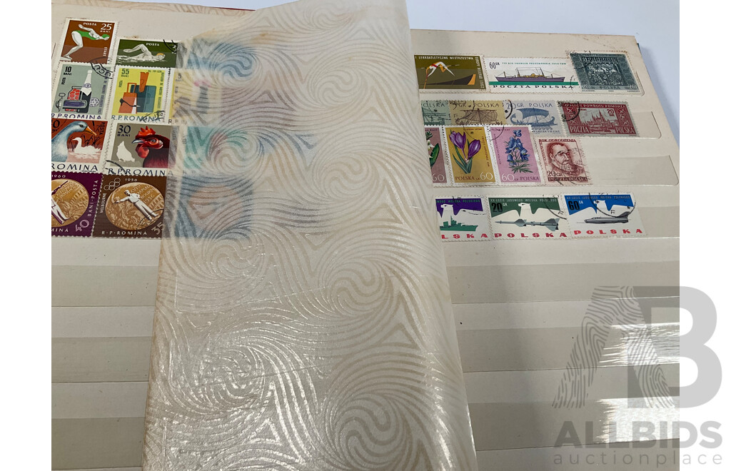 Two Albums of Vintage International Stamps Including Australian Predecimal, Canada, Great Britain, Philippines, Fiji, USA, Poland, Germany, New Zealand, Papua New Guinea and More