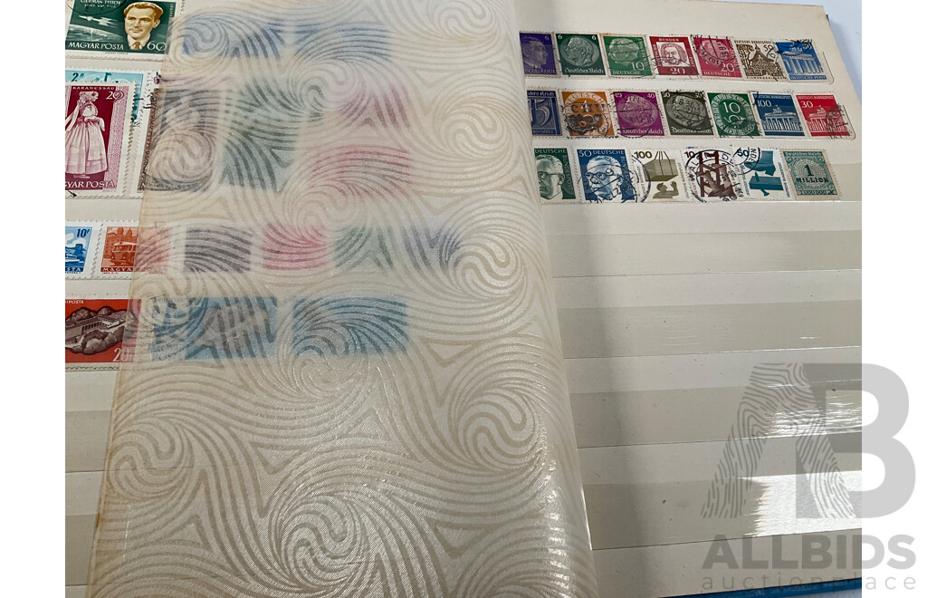 Two Albums of Vintage International Stamps Including Australian Predecimal, Canada, Great Britain, Philippines, Fiji, USA, Poland, Germany, New Zealand, Papua New Guinea and More
