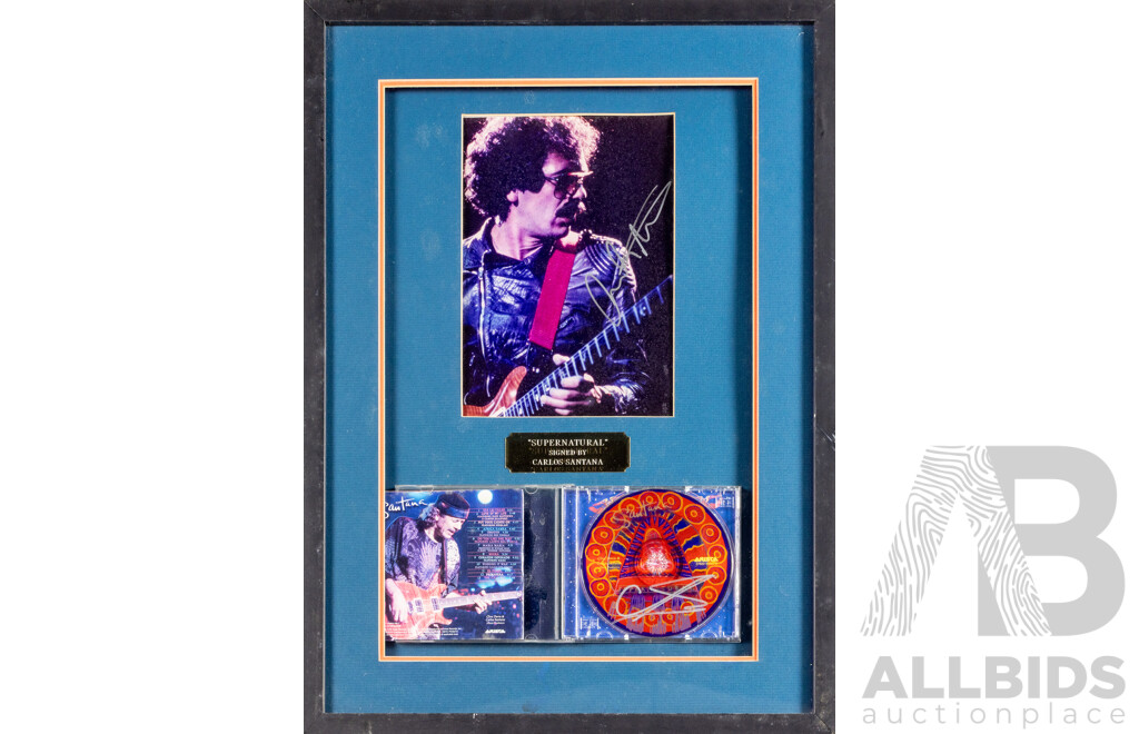Framed Carlos Santana Photograph and Supernatural CD, Both Signed by Santana, 58 x 43 cm (frame)