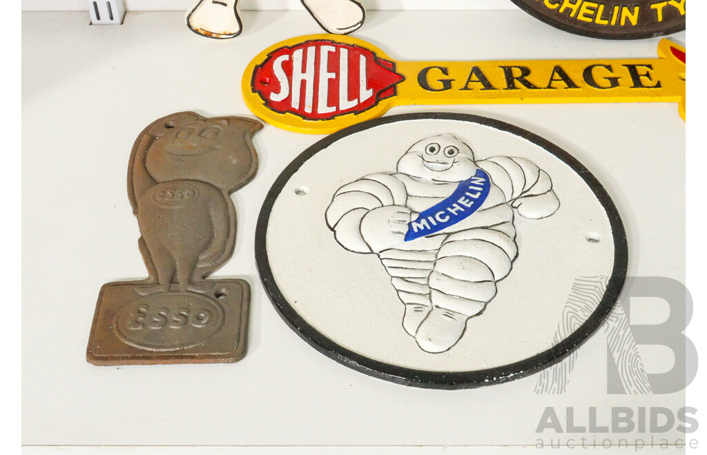 Collection of 5 Cast Iron Signs Including Michelin, Shell, and Esso