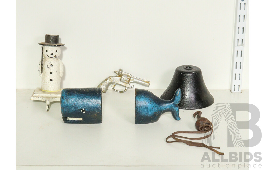 Collection of Cast Iron Including Bell, Whale Bookends, Gun and Snowman Key Holder