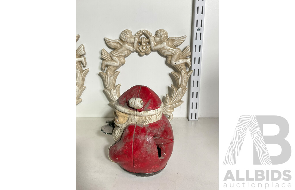 Collection of Mixed Cast Iron Including Two Angel Wall Mount, Smilin Sam and Santa Coin Bank