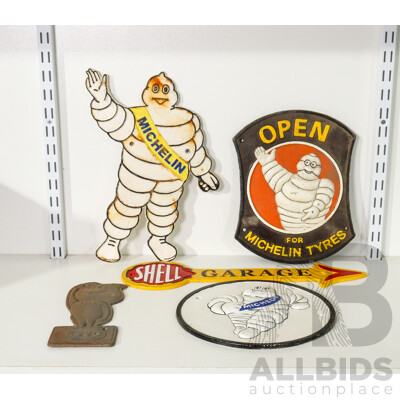 Collection of 5 Cast Iron Signs Including Michelin, Shell, and Esso