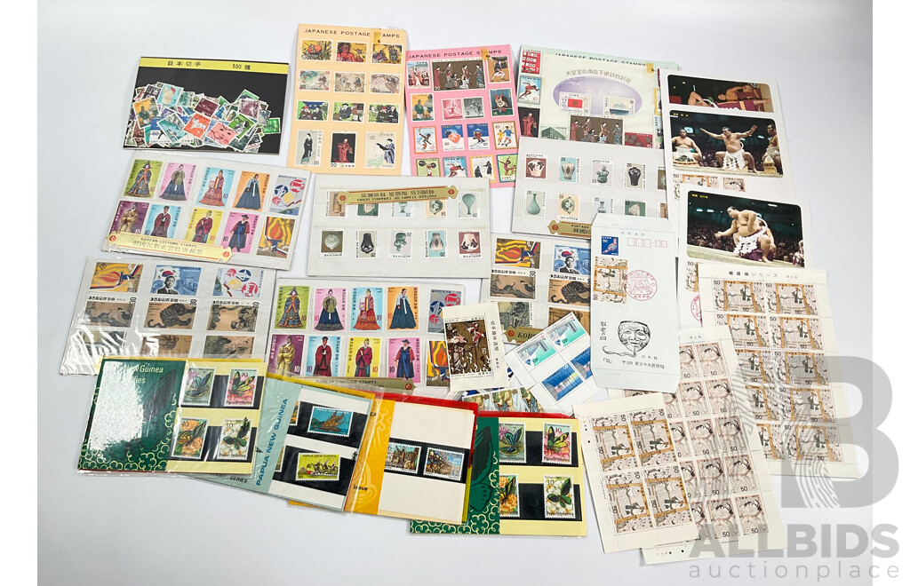 Collection of International Mint and Cancelled Stamps and Stamp Packs Including Papaua New Guinea, Japan, Korea, Canada