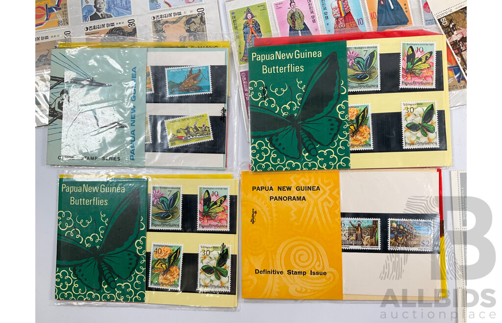 Collection of International Mint and Cancelled Stamps and Stamp Packs Including Papaua New Guinea, Japan, Korea, Canada