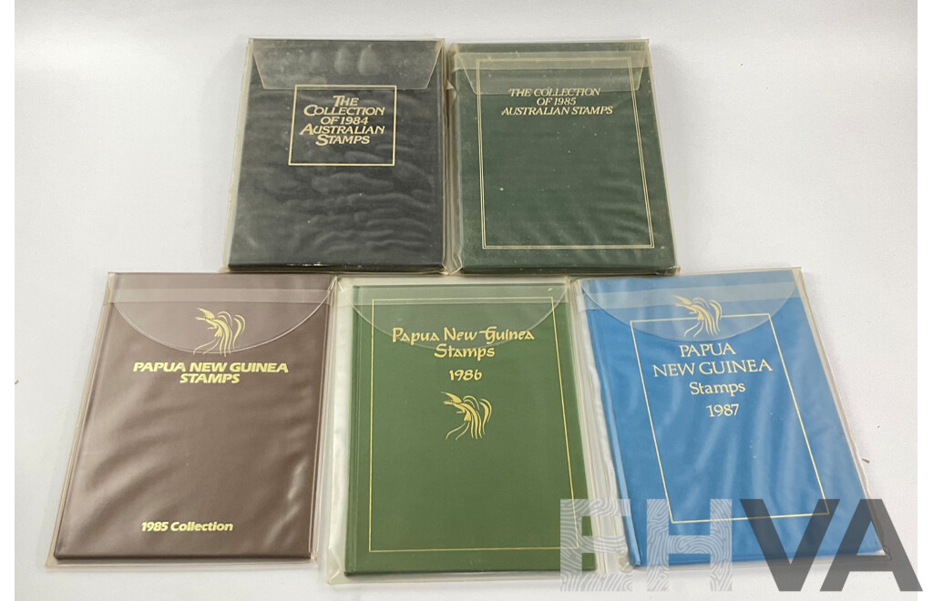 Two Australian Annual Stamp Albums 1984 and 1985 - Face Value $49 with Three Papua New Guinea Albums 1985, 1986, 1987