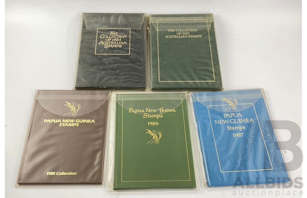Two Australian Annual Stamp Albums 1984 and 1985 - Face Value $49 with Three Papua New Guinea Albums 1985, 1986, 1987