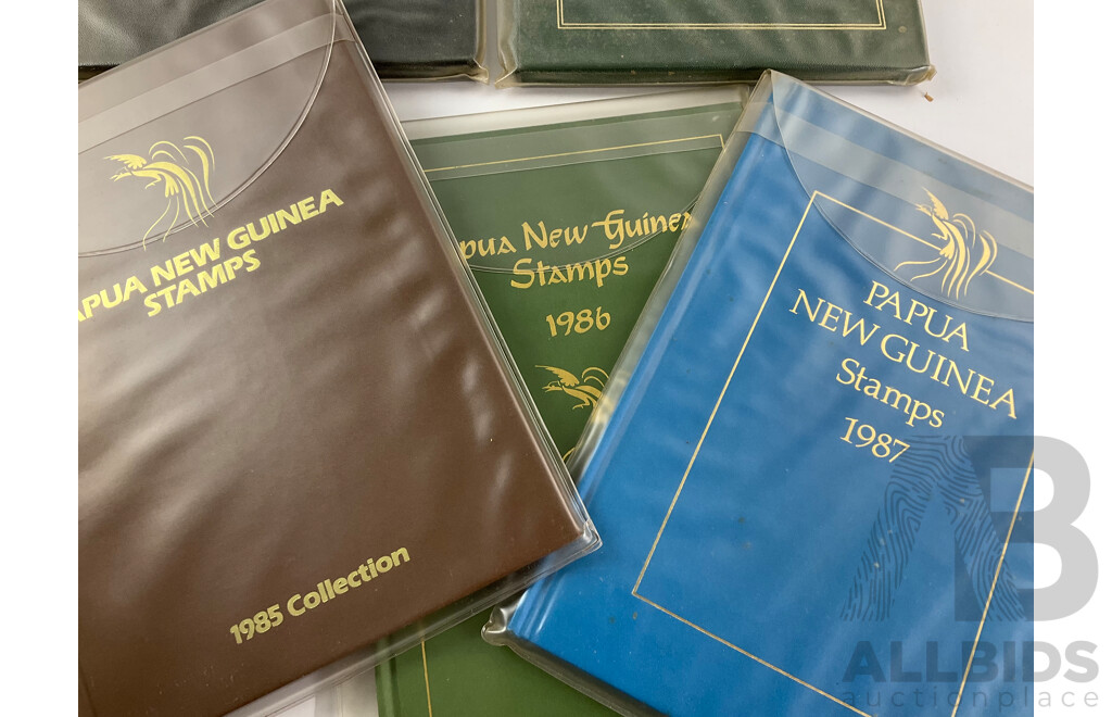 Two Australian Annual Stamp Albums 1984 and 1985 - Face Value $49 with Three Papua New Guinea Albums 1985, 1986, 1987