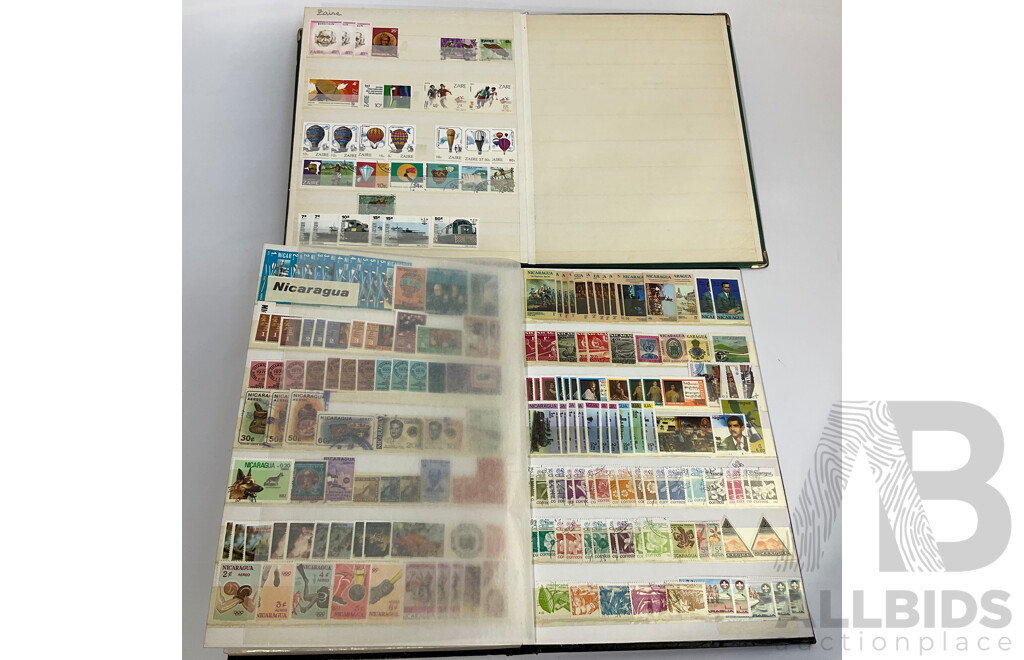 Two Albums of Antique and Vintage International Mint and Cancelled Stamps Including Zanzibar Nigeria, Guernsey, Zimbabwe, Zaire, Uruguay, Paraguay, Mexico, Brazil, Guyana, Colombia and More