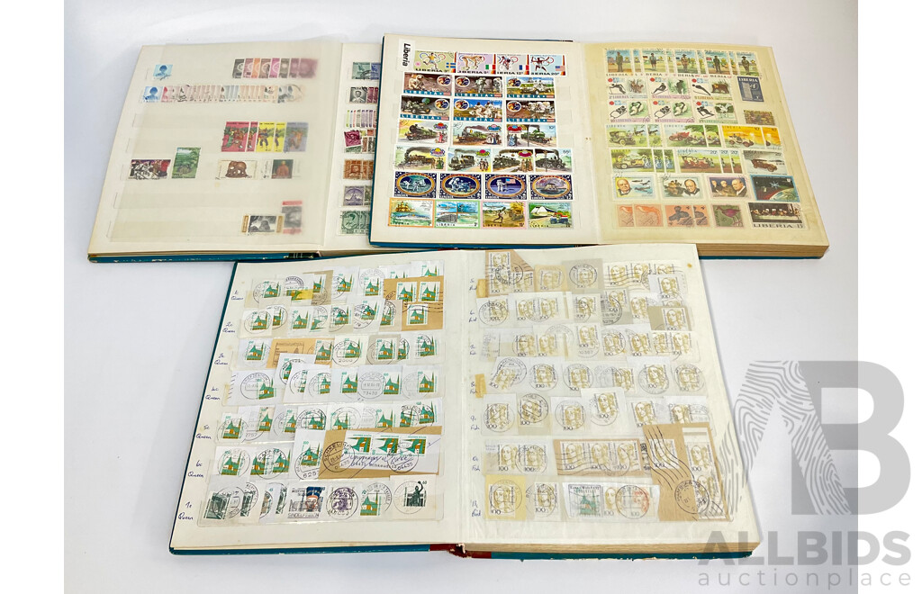 Three Albums of Vintage Cancelled and Mint Stamps Including Australia, Liberia, Mongolia, Thailand, Spain