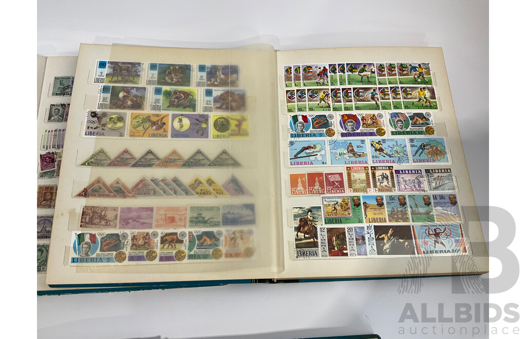Three Albums of Vintage Cancelled and Mint Stamps Including Australia, Liberia, Mongolia, Thailand, Spain