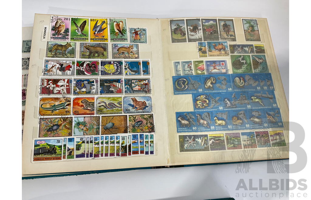 Three Albums of Vintage Cancelled and Mint Stamps Including Australia, Liberia, Mongolia, Thailand, Spain