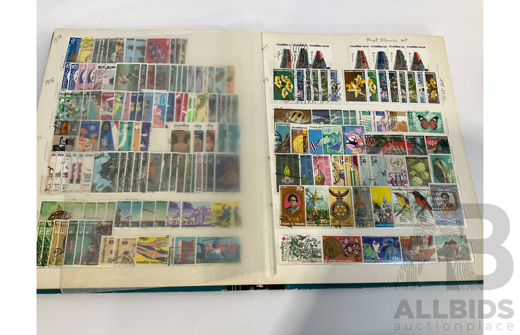 Three Albums of Vintage Cancelled and Mint Stamps Including Australia, Liberia, Mongolia, Thailand, Spain