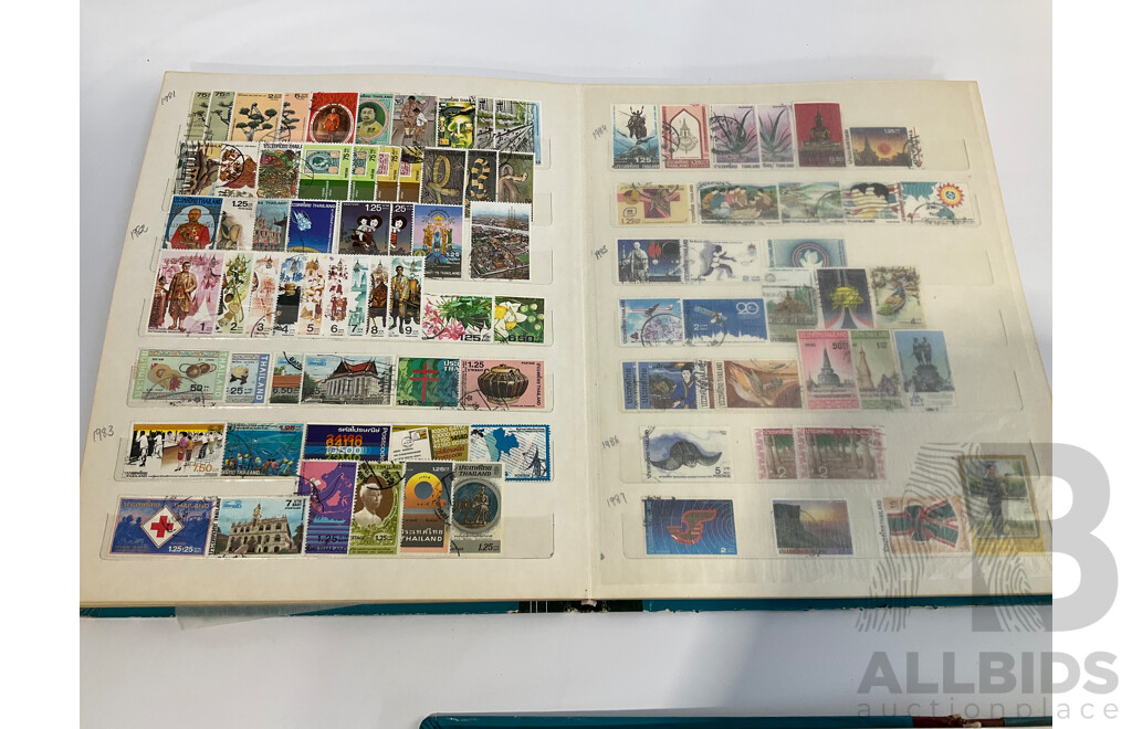 Three Albums of Vintage Cancelled and Mint Stamps Including Australia, Liberia, Mongolia, Thailand, Spain
