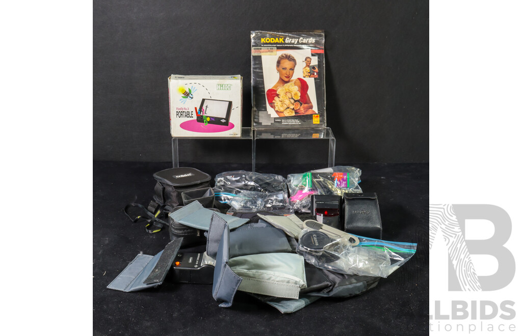 Collection of Camera Accessories Including Agfatronic and Minolta Flashes, Hoodman Hoodloupe, Chargers, SD Cards, Lens Caps, Portable Light Box