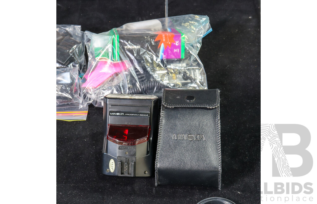 Collection of Camera Accessories Including Agfatronic and Minolta Flashes, Hoodman Hoodloupe, Chargers, SD Cards, Lens Caps, Portable Light Box