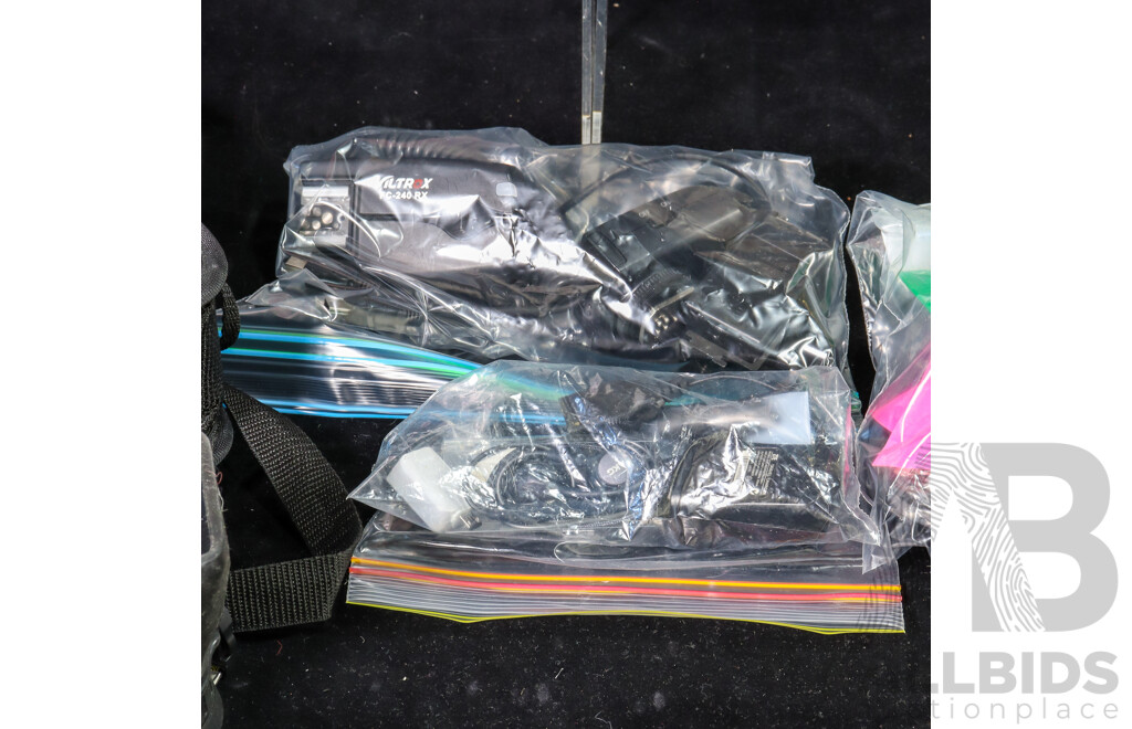 Collection of Camera Accessories Including Agfatronic and Minolta Flashes, Hoodman Hoodloupe, Chargers, SD Cards, Lens Caps, Portable Light Box