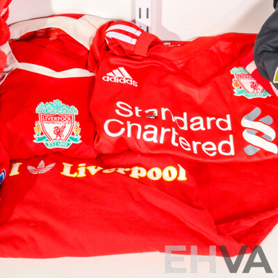 Collection of Official Liverpool Football Club Supporter Gear Including Jerseys, Scarves and Towels