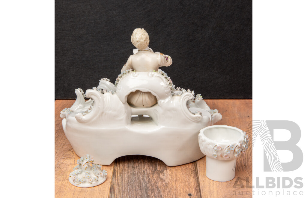a Porcelain Inkwell with Seated Gentleman and Applied Floral Decoration, Saxe Mark, C.1900