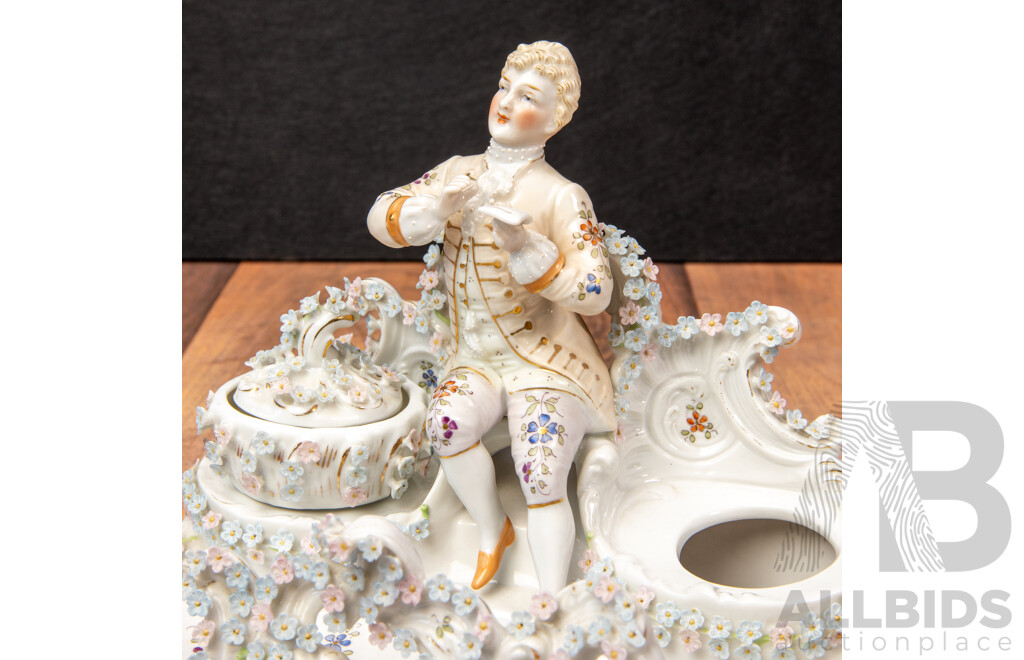a Porcelain Inkwell with Seated Gentleman and Applied Floral Decoration, Saxe Mark, C.1900
