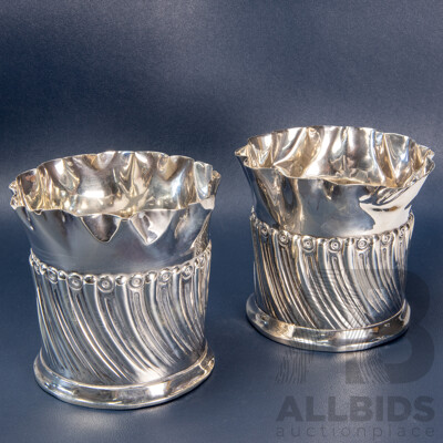 Pair of Repoussé William Comyns Sterling Silver Bottle Coasters, London, C.1893