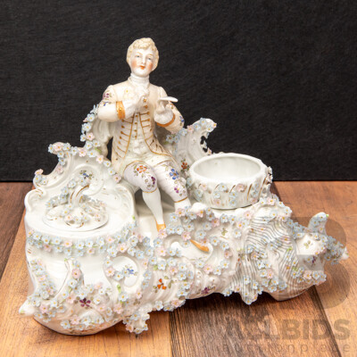 a Porcelain Inkwell with Seated Gentleman and Applied Floral Decoration, Saxe Mark, C.1900