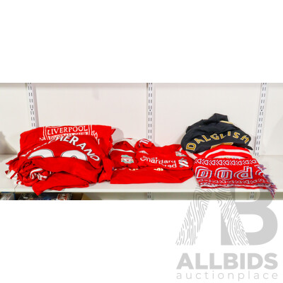 Collection of Official Liverpool Football Club Supporter Gear Including Jerseys, Scarves and Towels