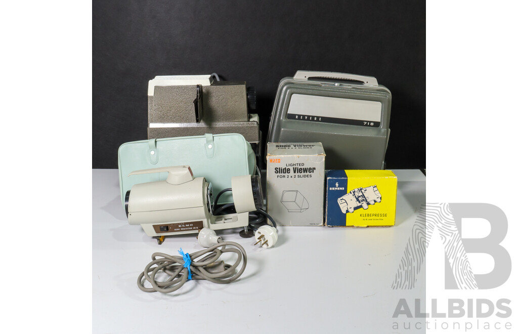 Collection of Vintage Movie Equipment Including Revere 718 8mm Film Projector, Bell & Howell Slide Projector,  Siemens Film Splicer, Lighted Slide Viewer and Elmo Slide Projectior