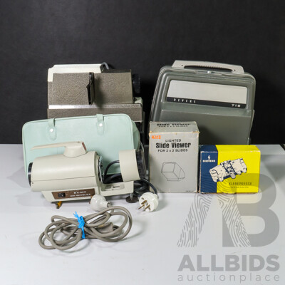 Collection of Vintage Movie Equipment Including Revere 718 8mm Film Projector, Bell & Howell Slide Projector,  Siemens Film Splicer, Lighted Slide Viewer and Elmo Slide Projectior