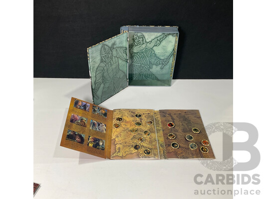 Collection of Lord of the Rings Paraphernalia in Original Packaging Including Pin Collection, Cards, Clock, Sticker Collection Book, Tin Container and More