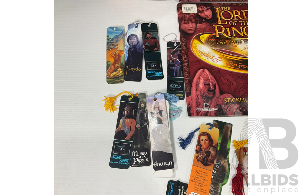 Collection of Lord of the Rings Paraphernalia in Original Packaging Including Pin Collection, Cards, Clock, Sticker Collection Book, Tin Container and More